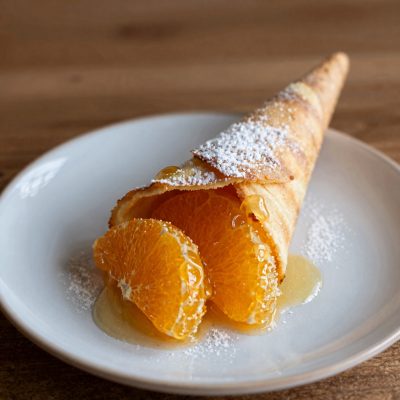 Crespelle al miele e succo di limone e arancia